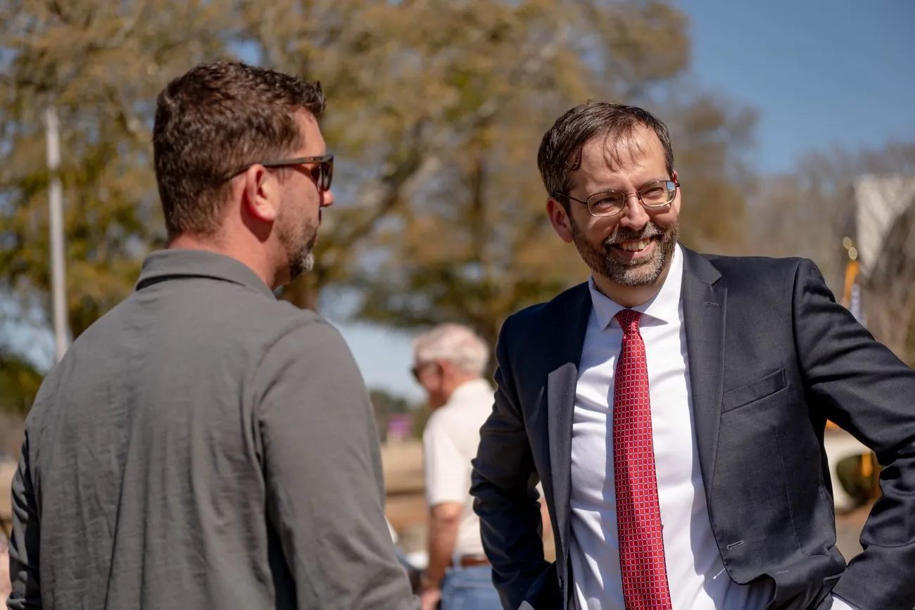Shane Gottwals shaking hands at a community event